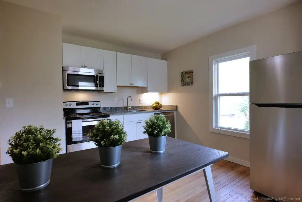 Open kitchen and living area in a multi-level King Street apartment in North End Detroit