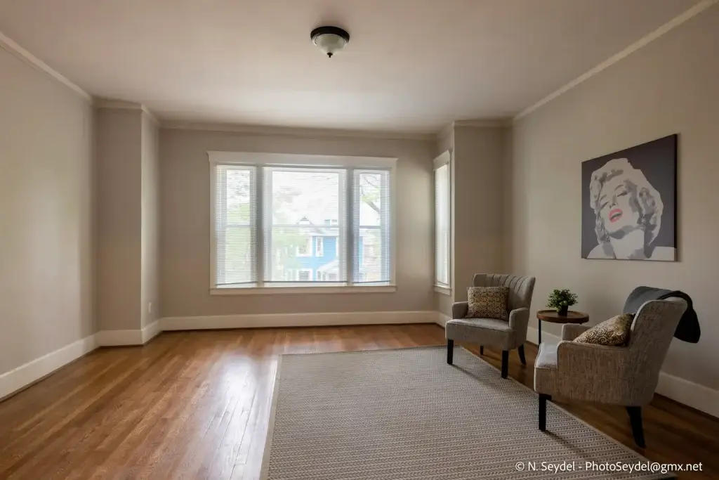 Renovated apartment interior with original hardwood floors at Blaine Street near North End Detroit